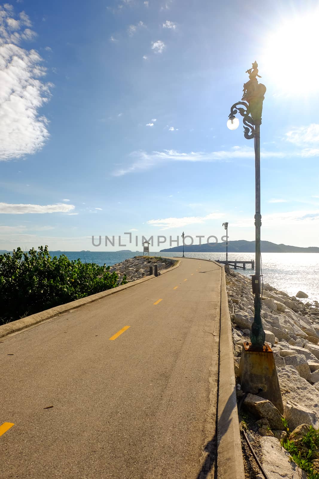 Walkway to the viewpoint with a white pavilion at the destination at Khao Laem Ya National Park, Rayong.