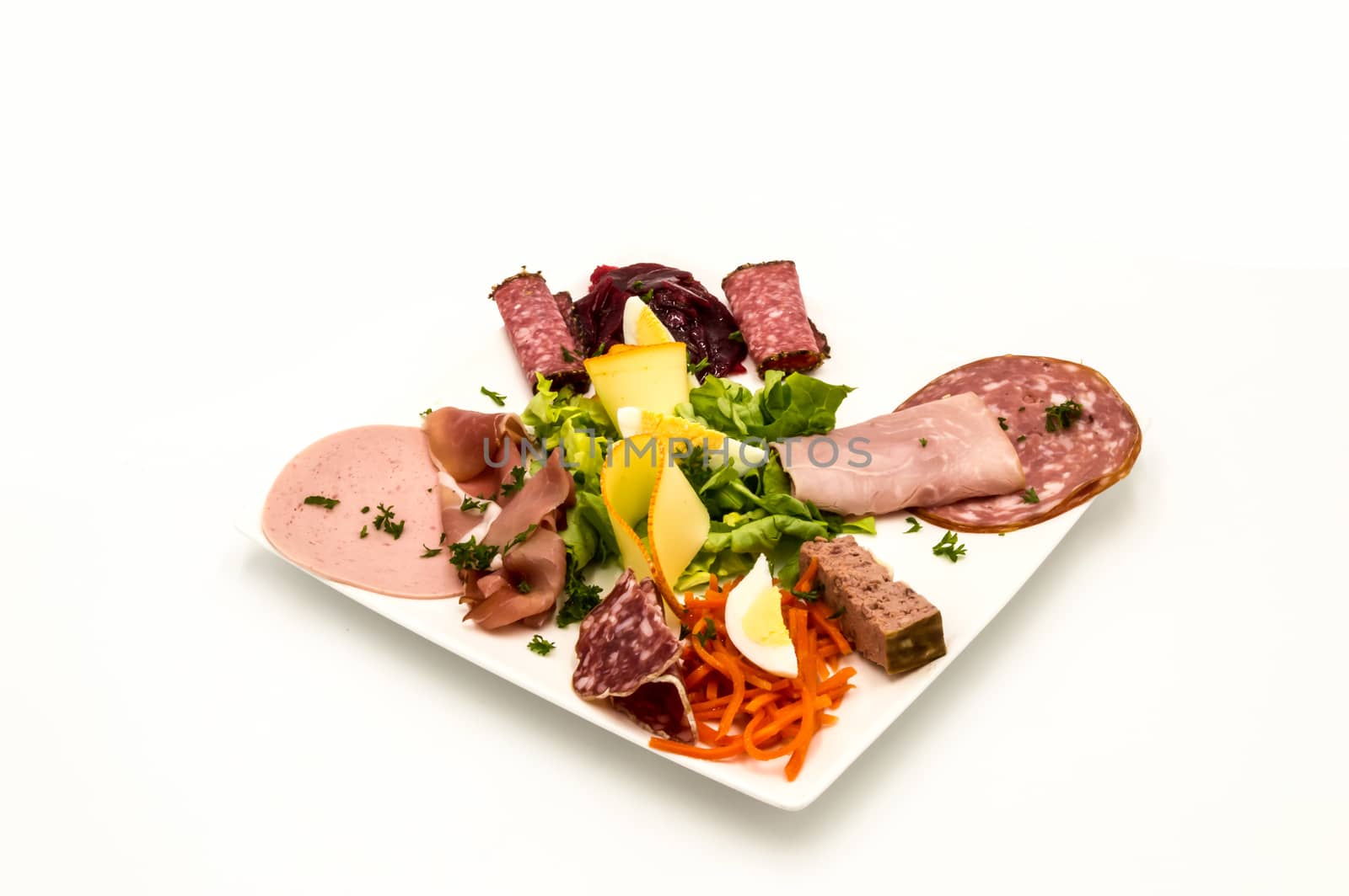 Plate of cold cuts and cheese with raw vegetables  by Philou1000