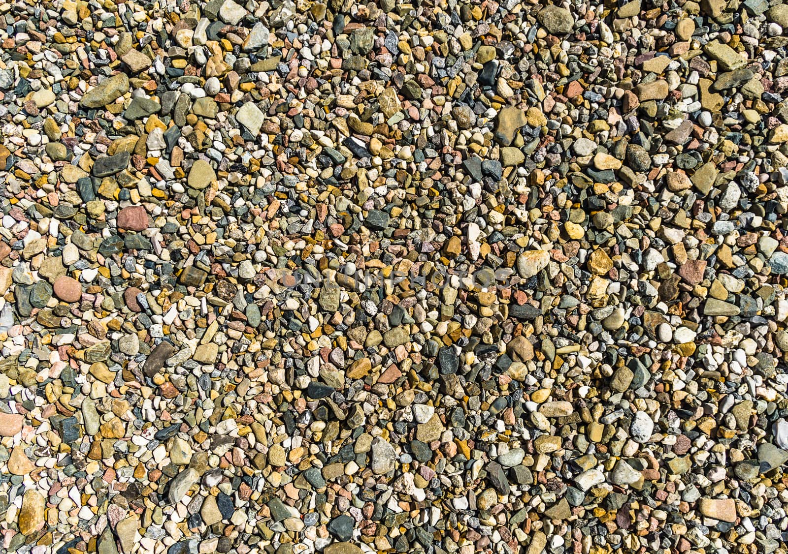 Coloured gravel and sand as a texture and background, in the abs by geogif
