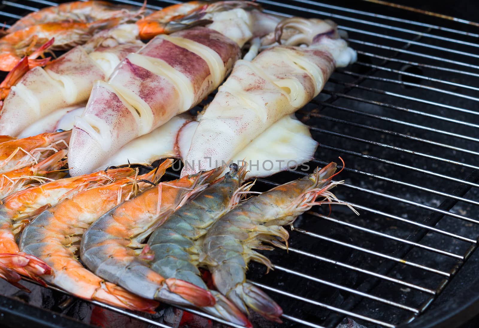 Close up fresh seafood grilled, prawn and squid grilled