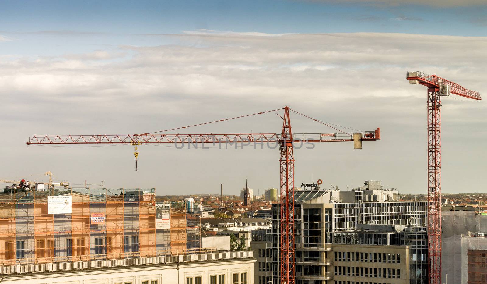 Leipzig, Saxony, Germany - October 21 2017: View over the city centre of Leipzig with construction cranes over the roofs of the city