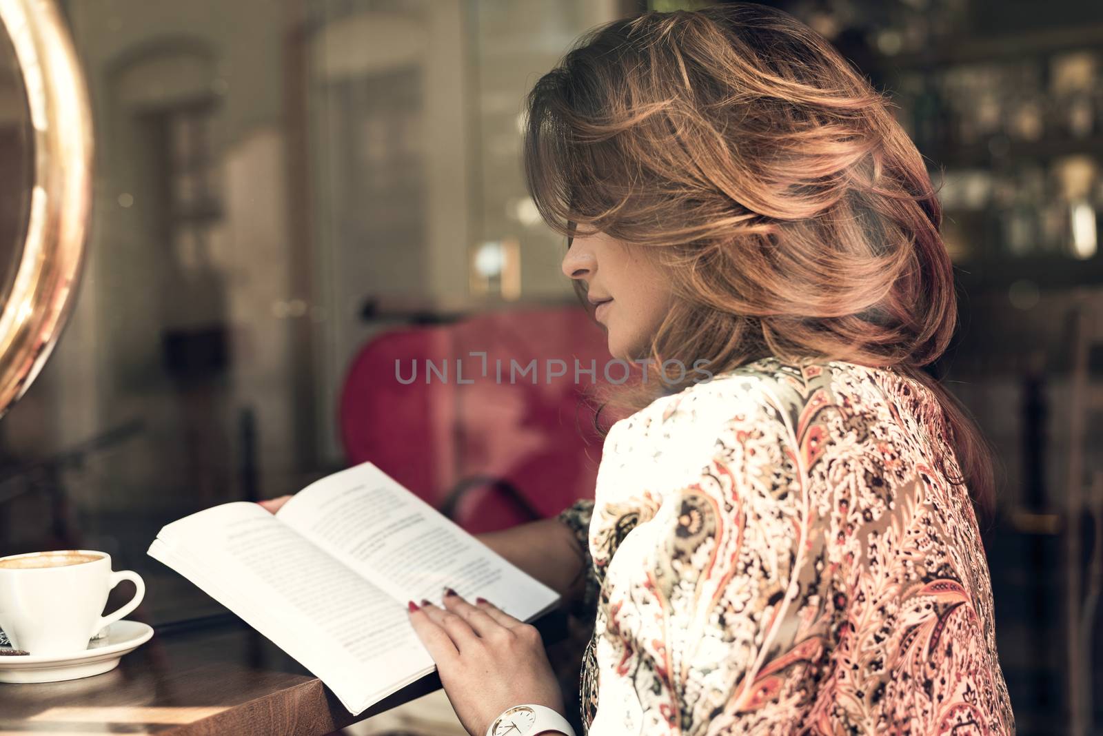 Woman reading book by wdnet_studio