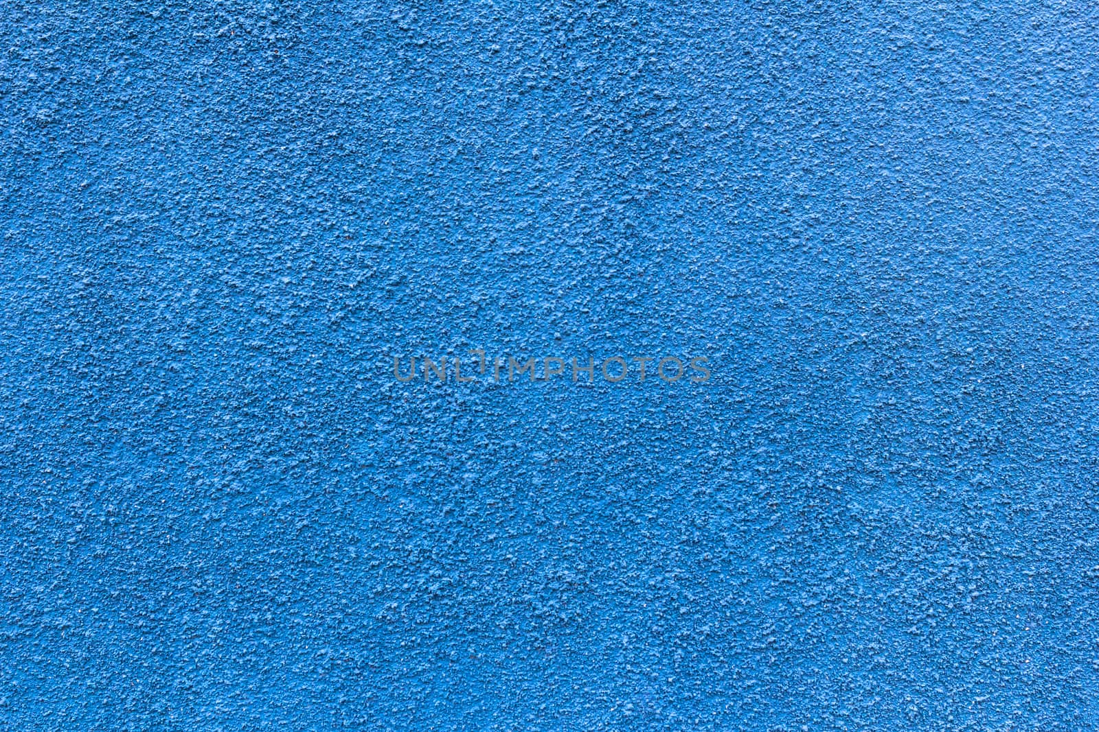 Abstract deep blue wall plastered texture. Rustic background.