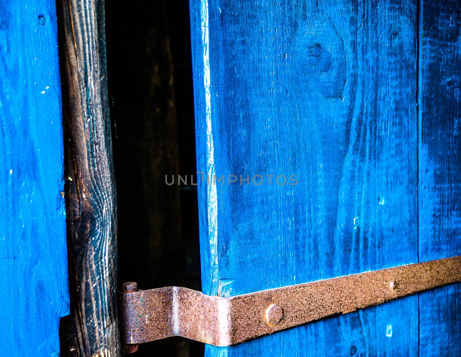 Abstract picture, cutting of a blue old wooden door