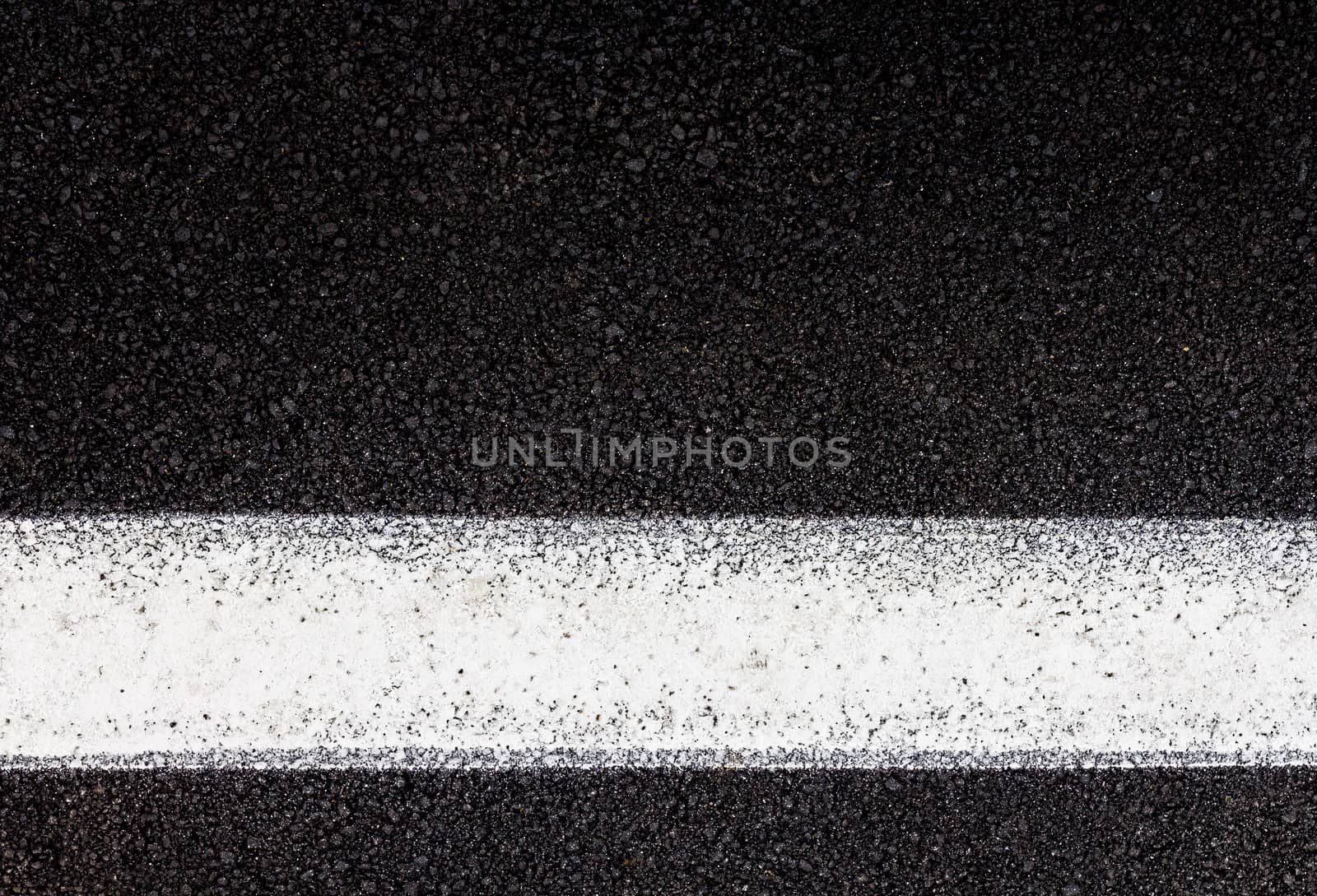 Tarmac background and texture. White line on road.