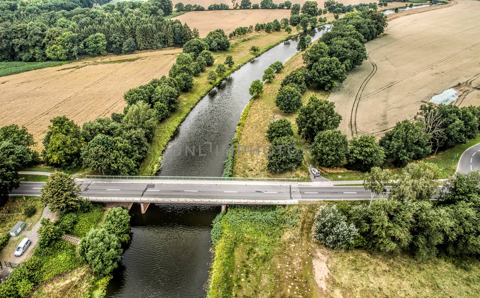 Admission with the drone of a small river with a bridge between fields, Aller, nearness Celle, Germany