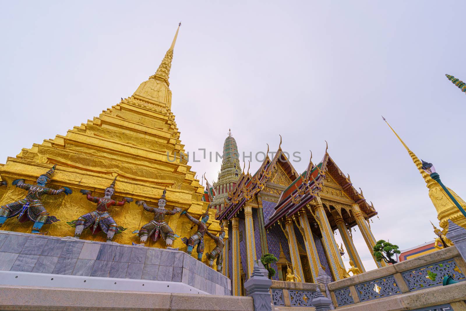 BANGKOK/THAILAND-JUNE 14: Wat Phra Kaew, wat Phra Si Rattana Satsadaram or Temple of the Emerald Buddha entrance that has beautiful to golden Hor Phra Rajkoramanusorn landmark in city on 06 14 2020