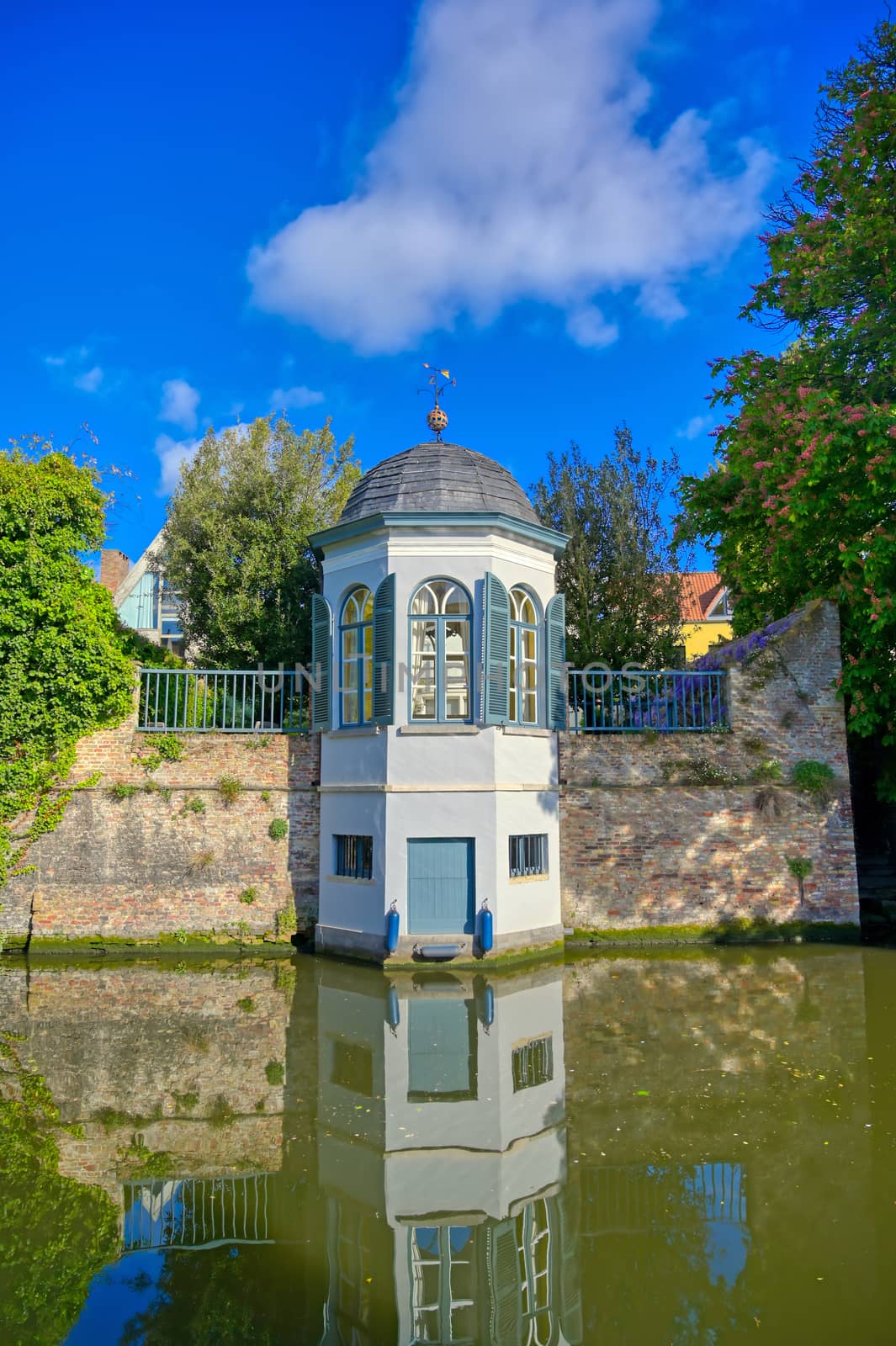 The canals of Bruges (Brugge), Belgium on a sunny day.