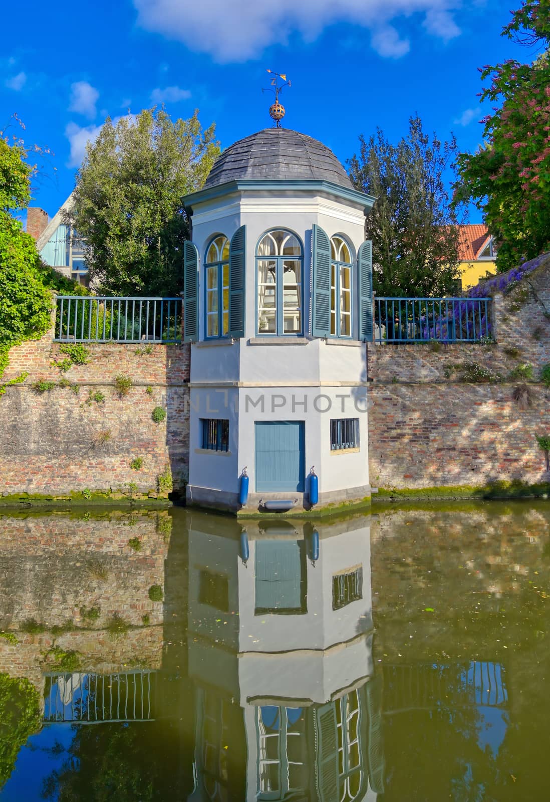 The canals of Bruges (Brugge), Belgium on a sunny day.