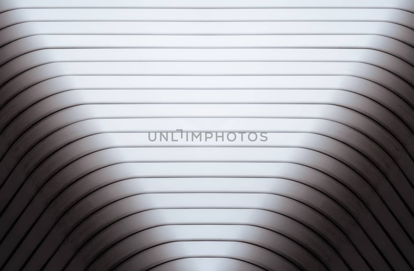 gray curved wall of a modern building monochrome abstract architectural background pattern