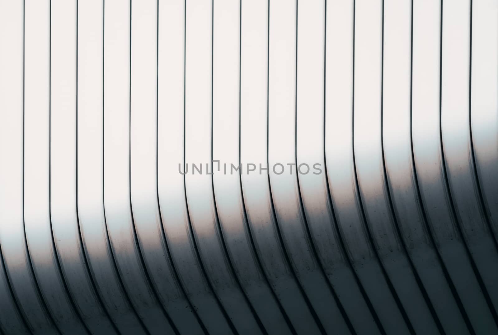 gray curved wall of a modern building monochrome abstract architectural background pattern