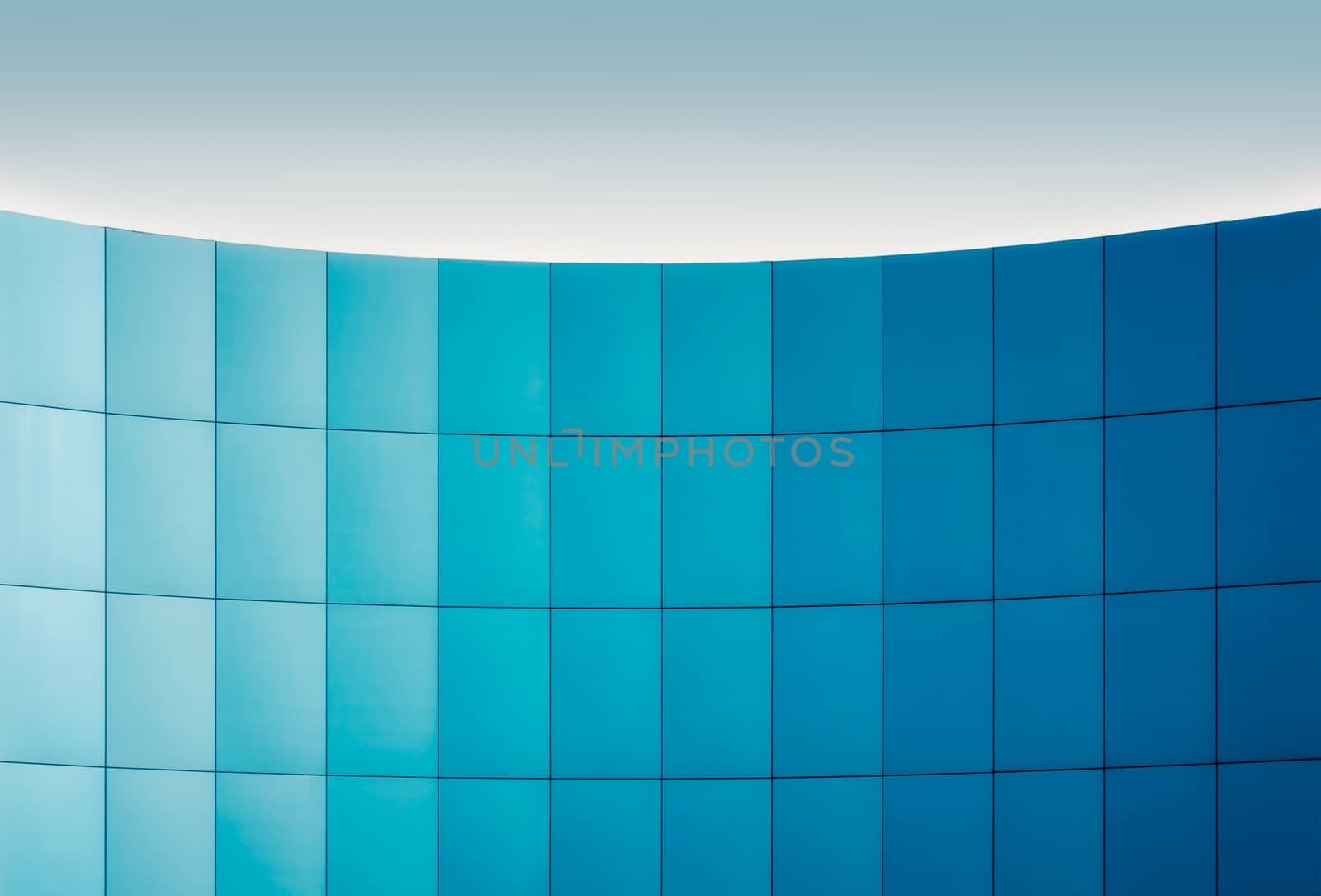 wall of a modern building with a gradation of blue architectural abstract background pattern