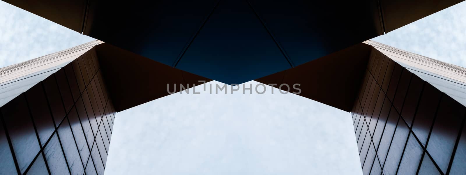 wall and arch of modern tall building against sky and clouds abstract architectural background