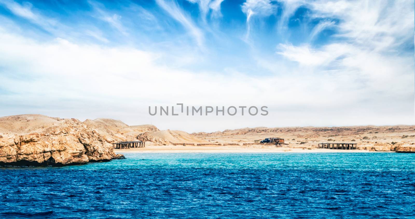 landscape rocky coast of the Red Sea and blue sky with clouds in Sharm El Sheikh Egypt