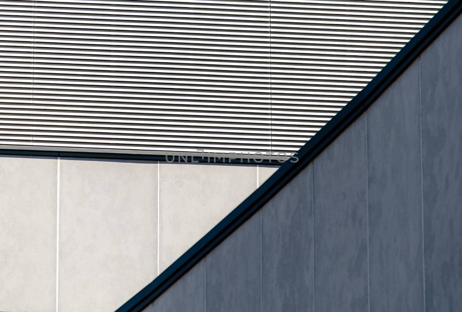 architectural abstract background of a striped wall and concrete walls