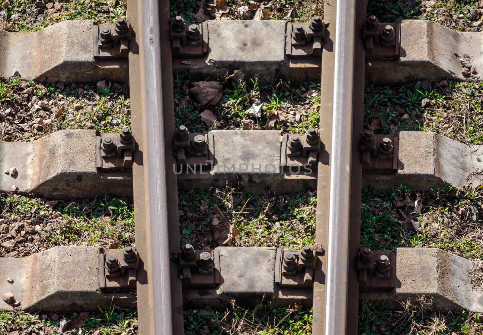 rails and stone sleepers of the old railway technical background in detail close up