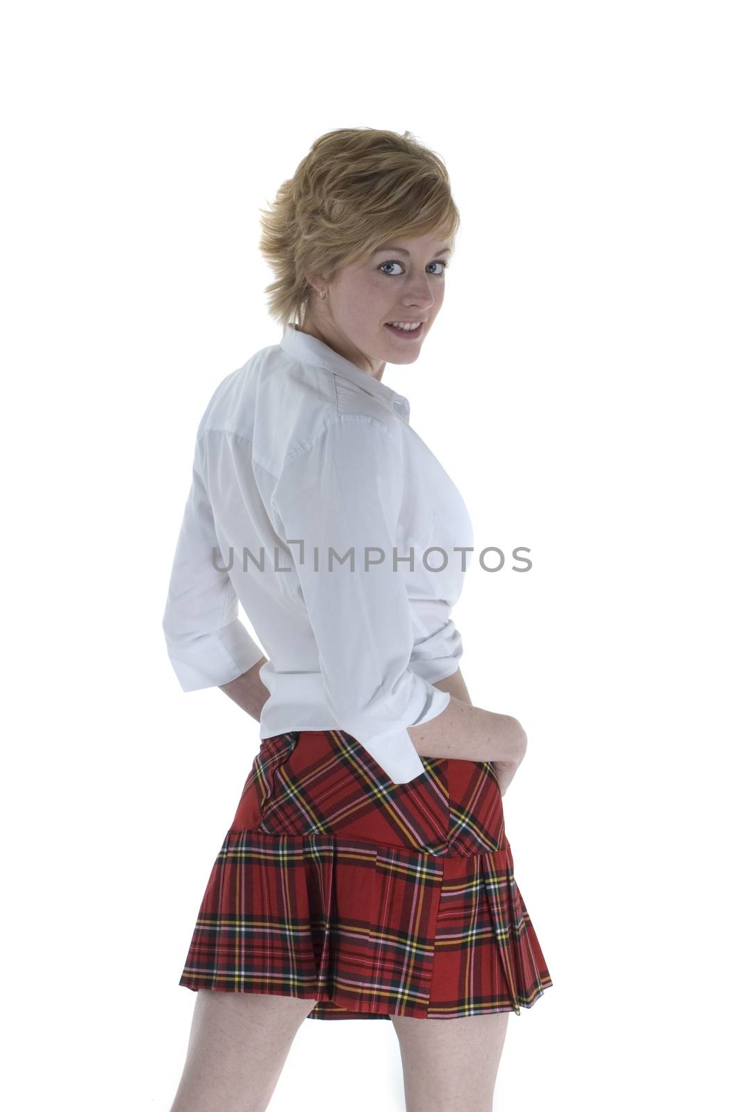 An attractive blonde woman in a tartan skirt and white blouse