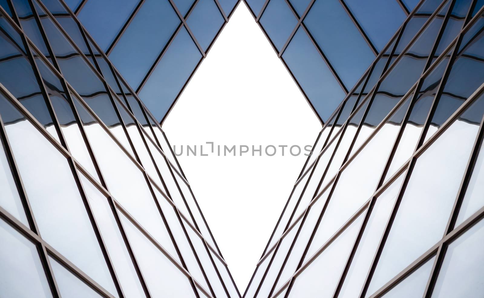 distorted reflection in the mirrored windows of a modern building abstract geometric color blue architectural background pattern