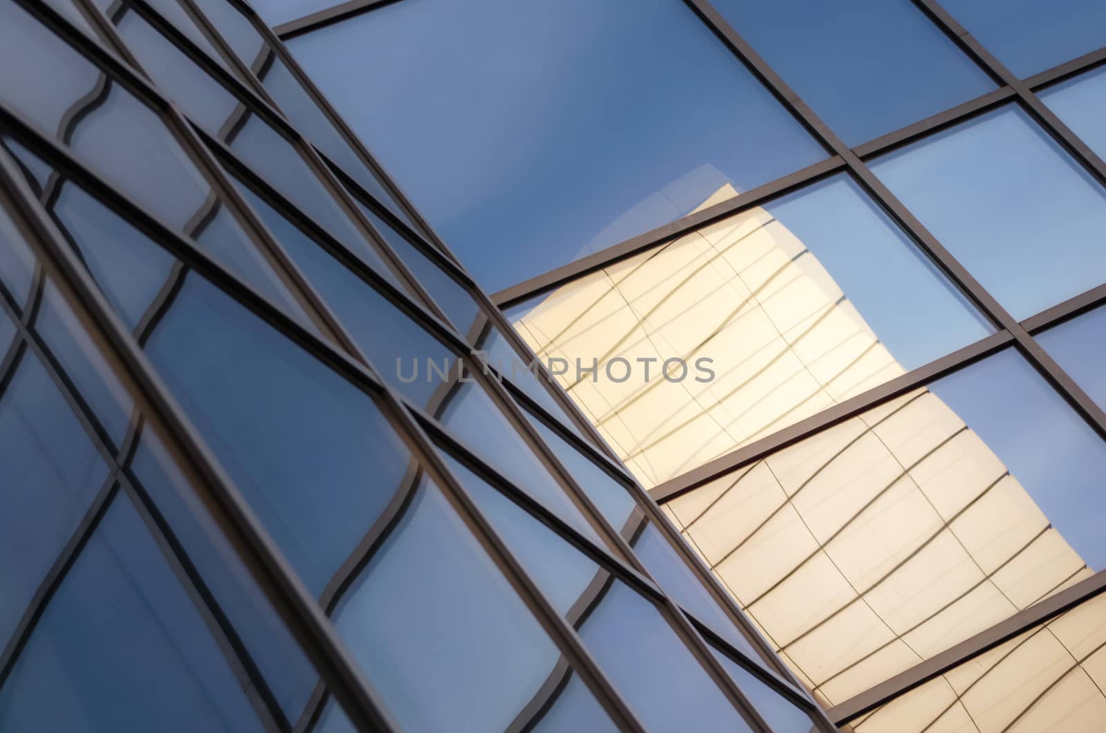 reflection with distortion in the window of a modern building color blue abstract urban background