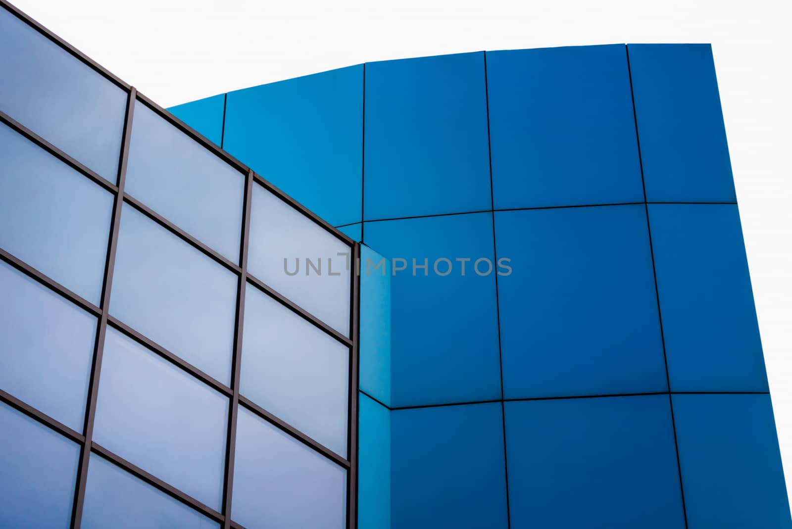 tall blue modern building with windows architectural abstract background pattern