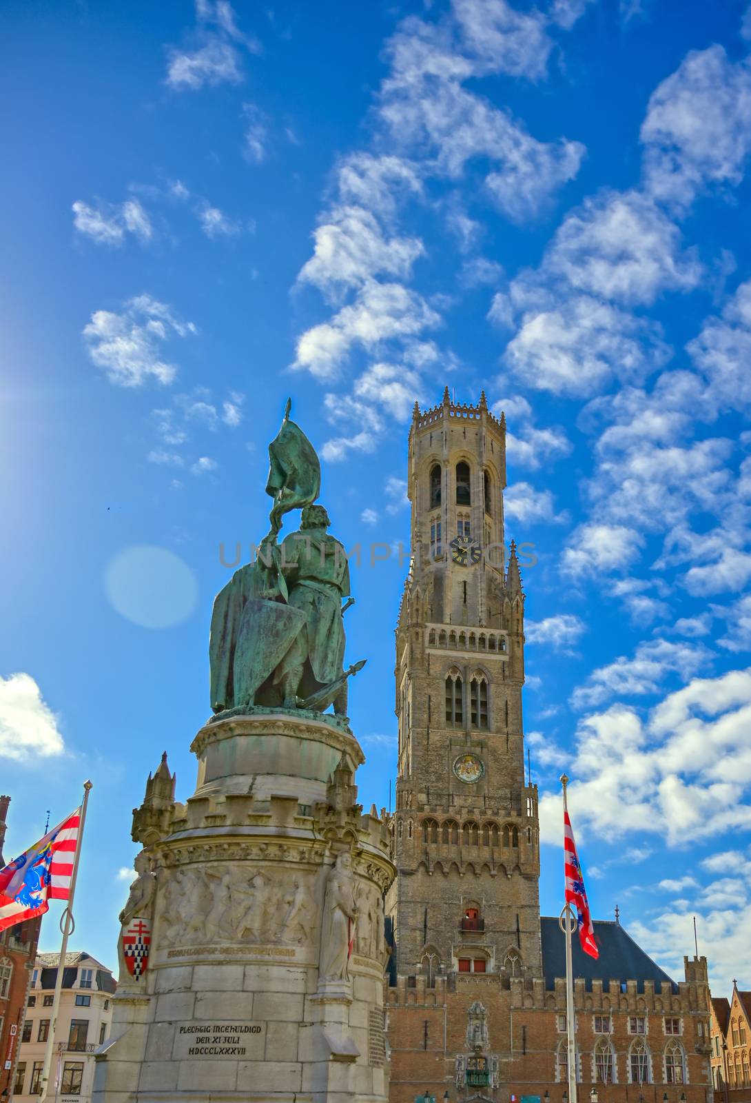 The Jan Breydel and Pieter de Coninck statue located in the historical city center and Market Square (Markt) in Bruges (Brugge), Belgium on a sunny day.