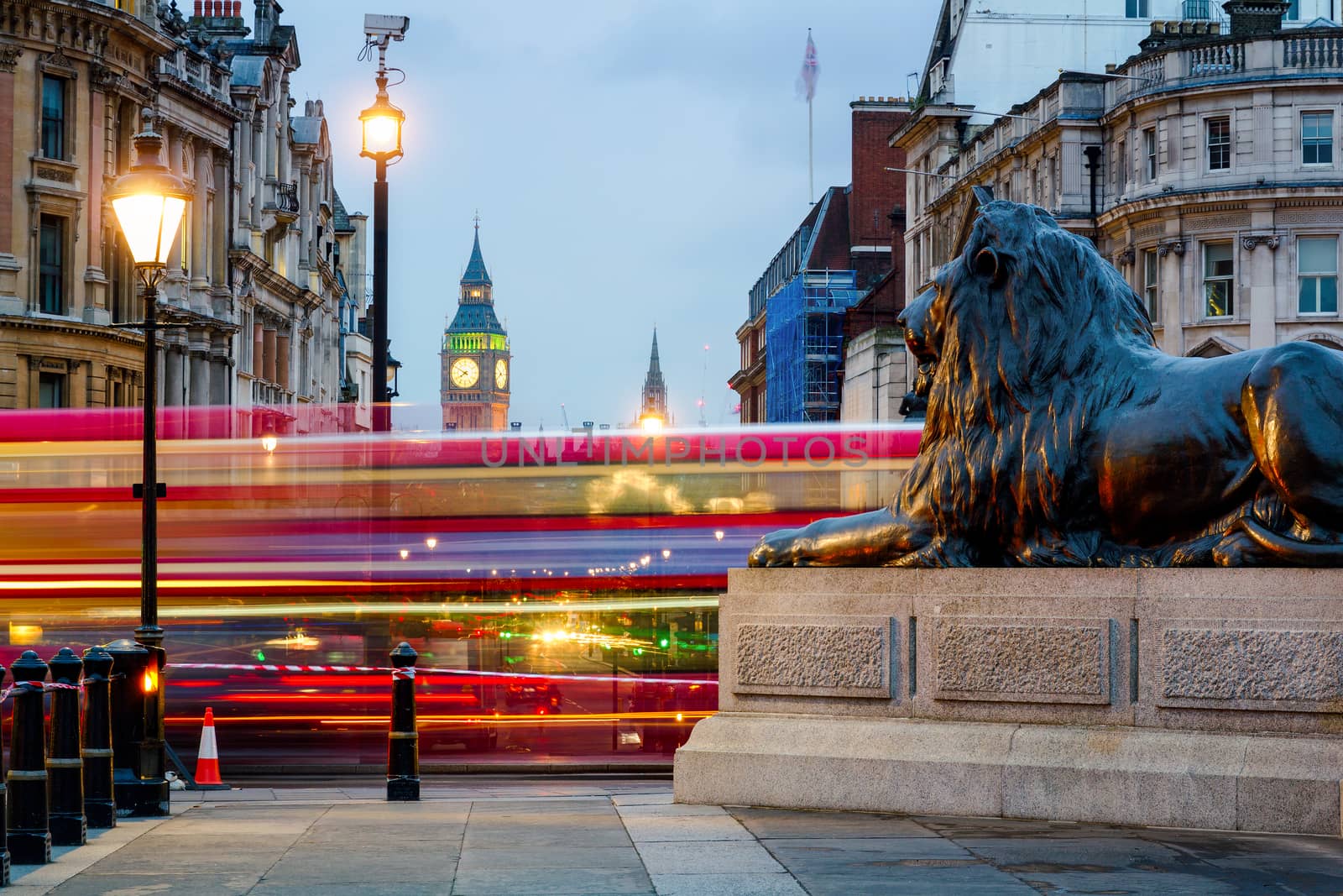London Trafalgar Square lion and Big Ben tower at background, London, UK