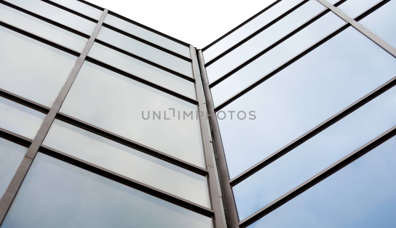 empty windows without people in a tall modern office building abstract architectural background