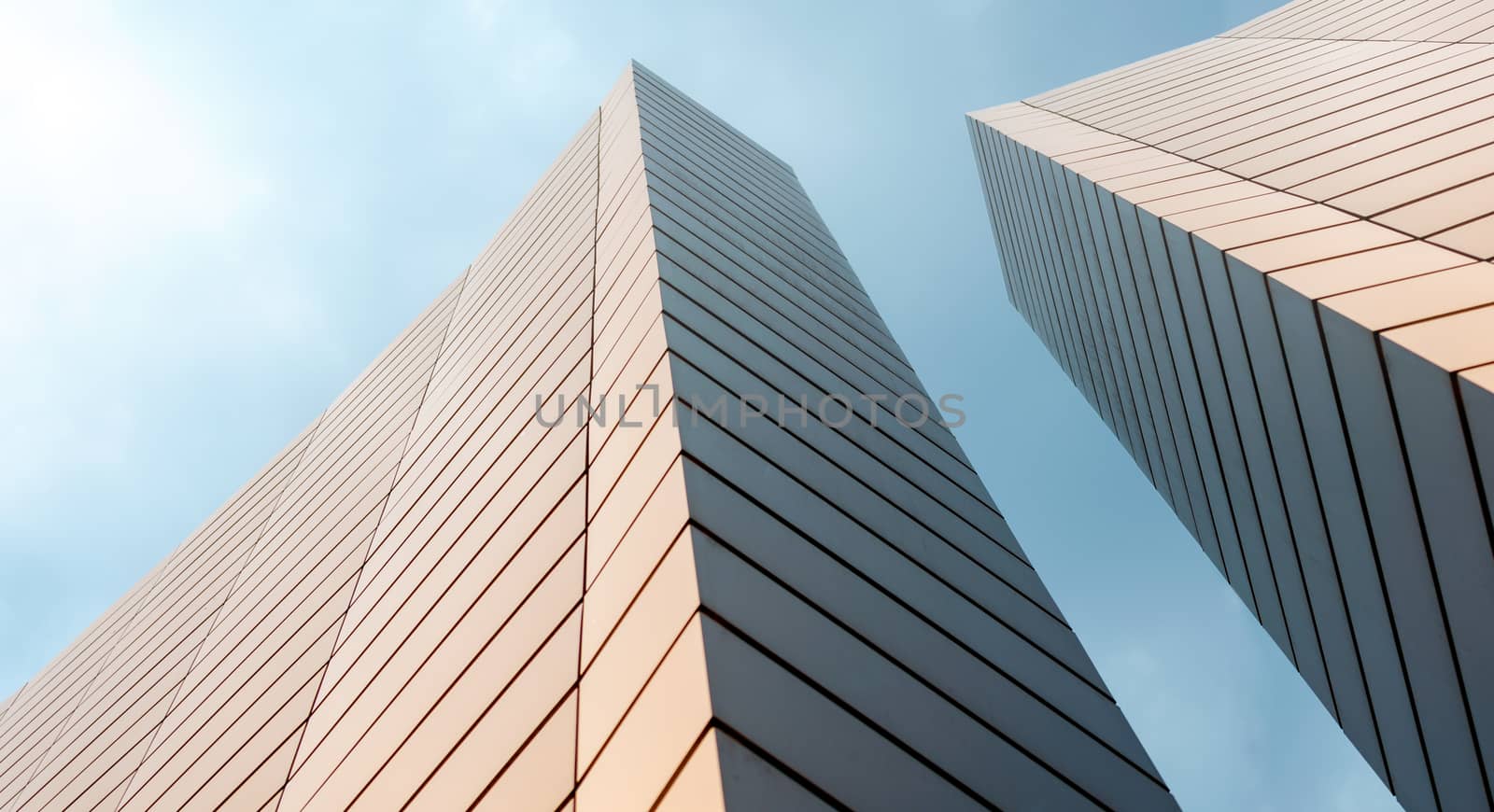 wall of a modern building on a background of blue sky abstract architectural background