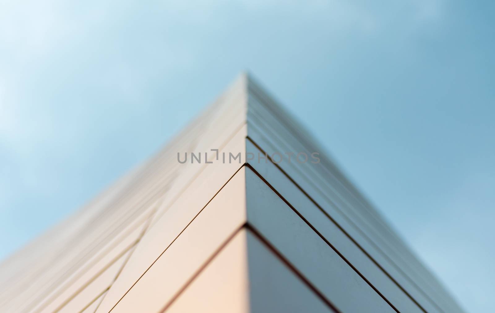 wall of a modern building on a background of blue sky abstract architectural background