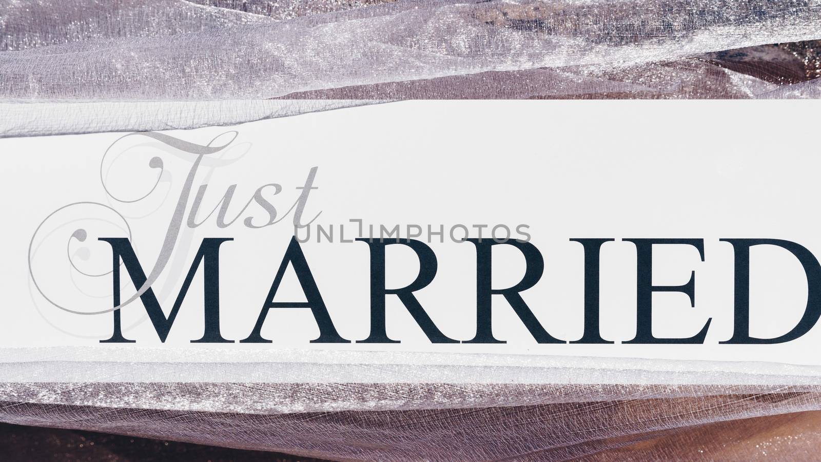 Just Married text on white background with flowers