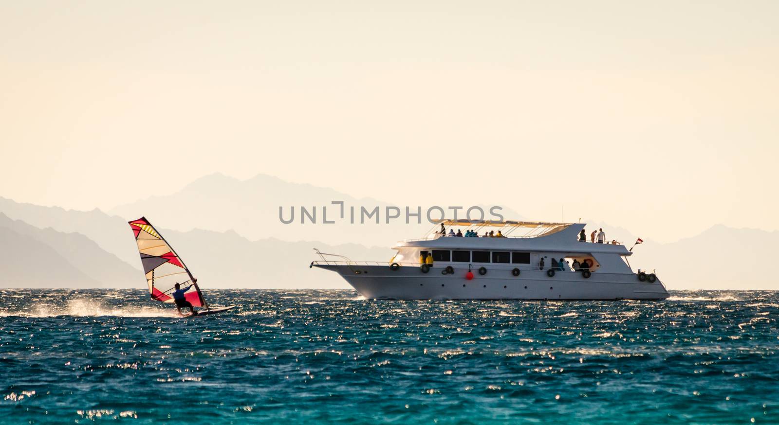 big boat and windsurfer on the background of high mountains in Egypt Dahab