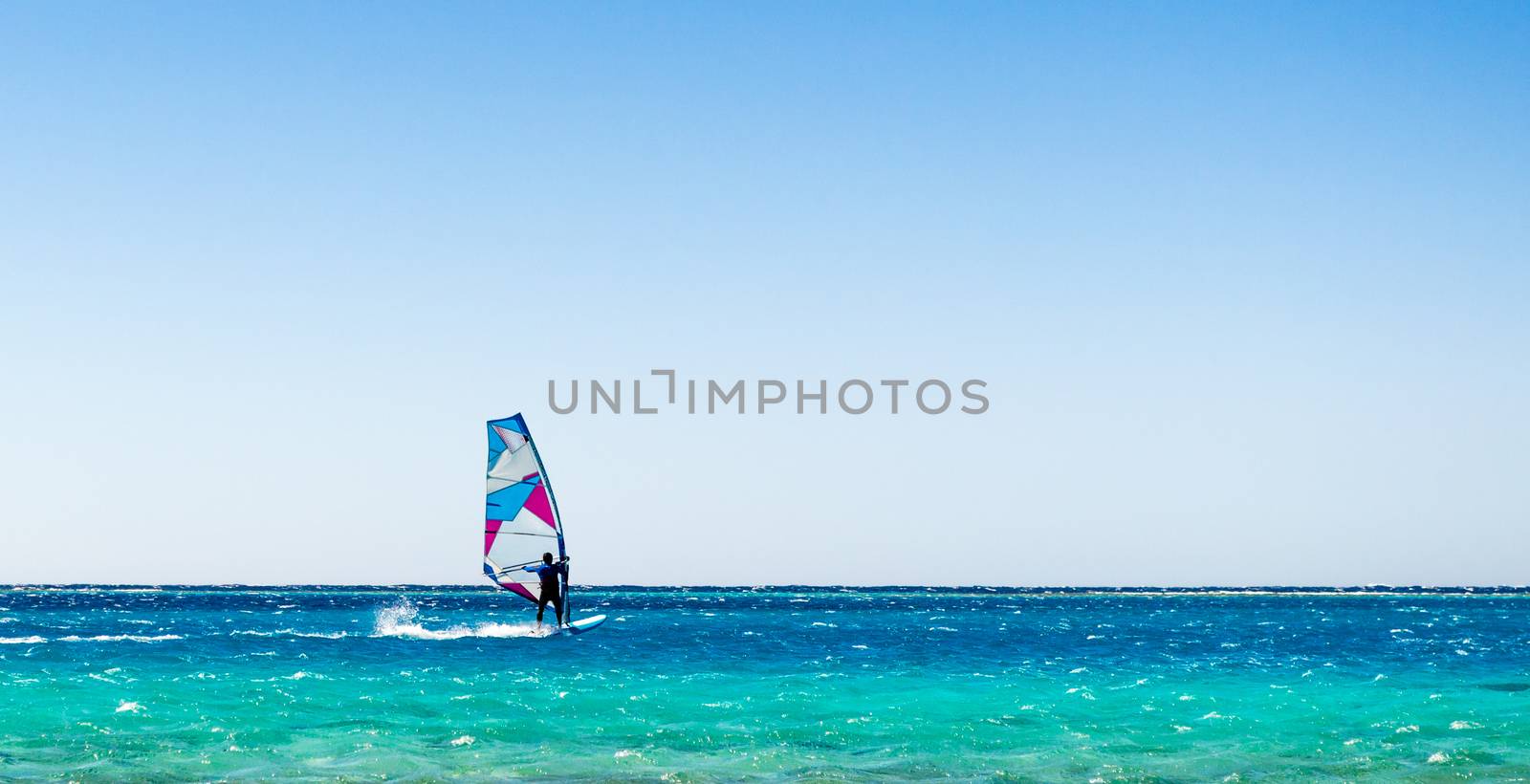 surfer rides in the Red Sea in Egyp