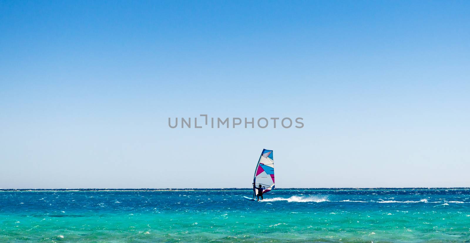 windsurfer rides in the sea in Egypt Dahab
