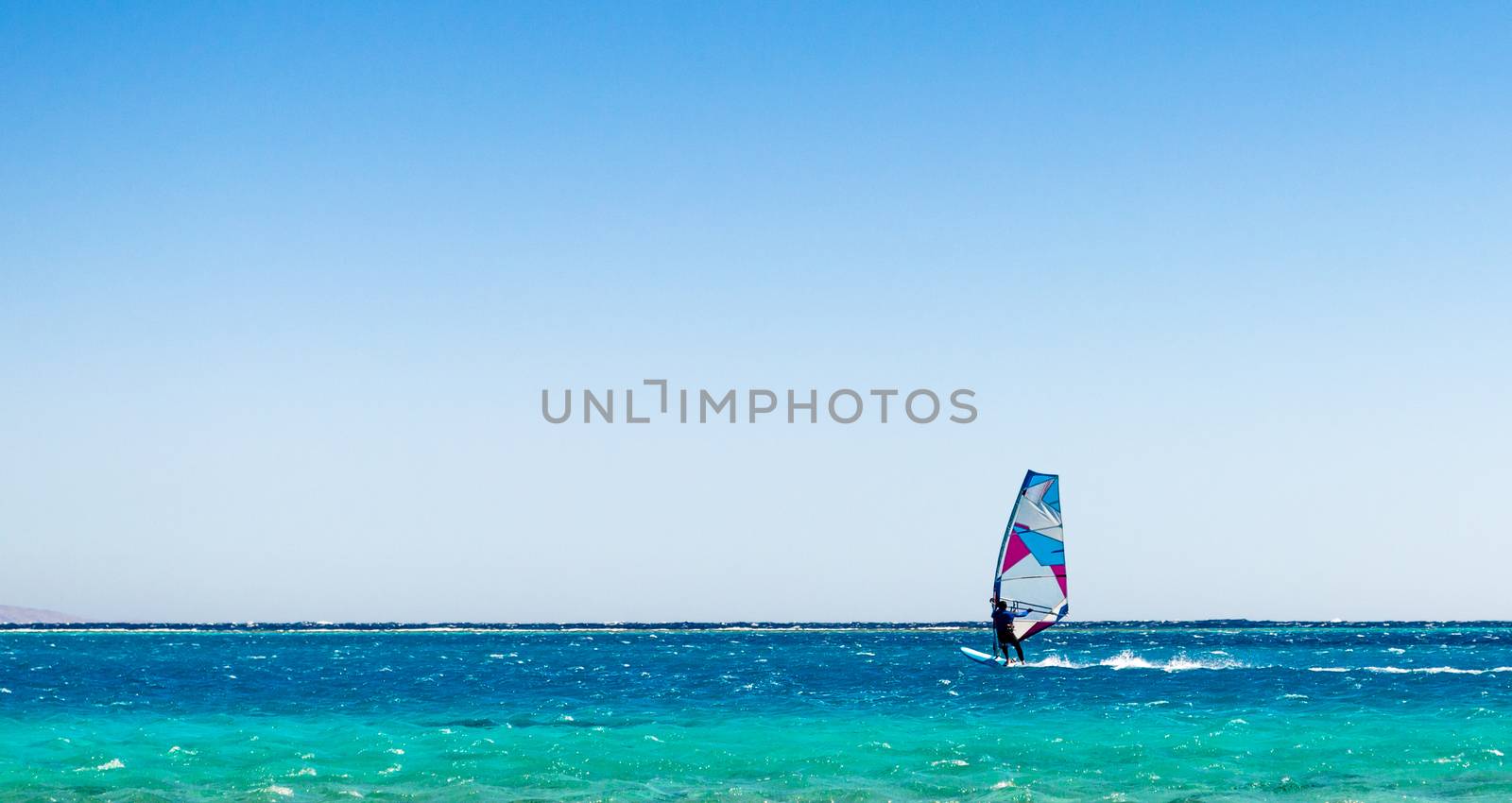 surfer rides in the Red Sea in Egyp