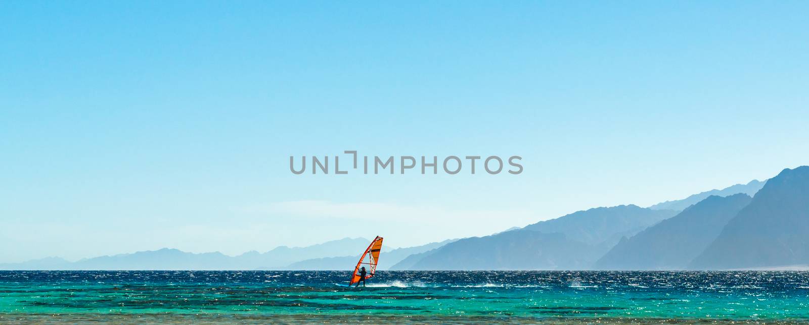 surfer rides in the Red Sea in Egypt