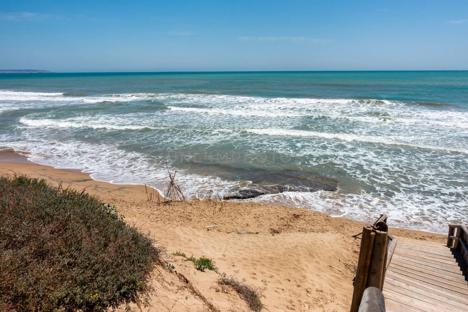 coastal sea, surf and sand on Guardamar beach area near Alicante