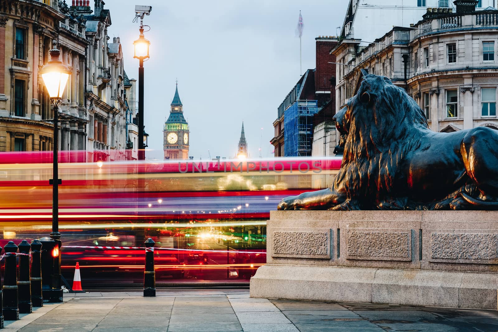 Street view of Trafalgar Square towards Big Ben at night in London, UK