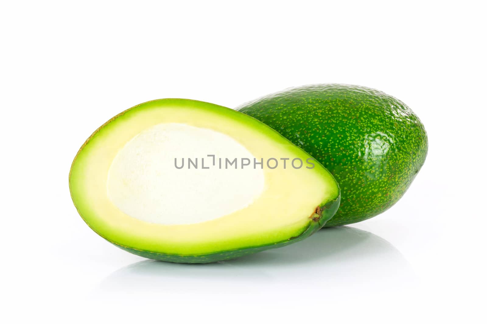 Slices of ripe avocado isolated on the white background