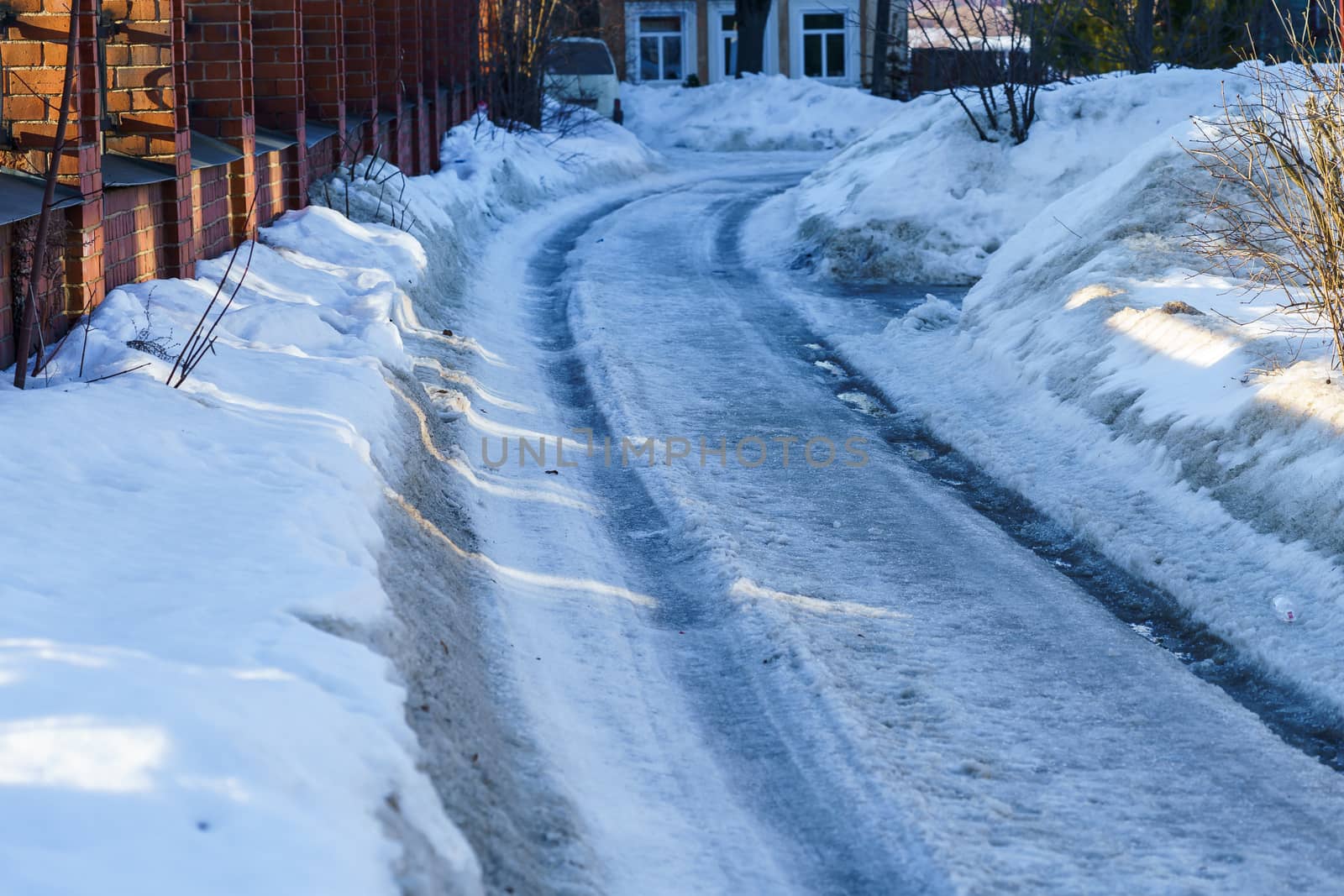 road covered with snow and ice with ruts by VADIM