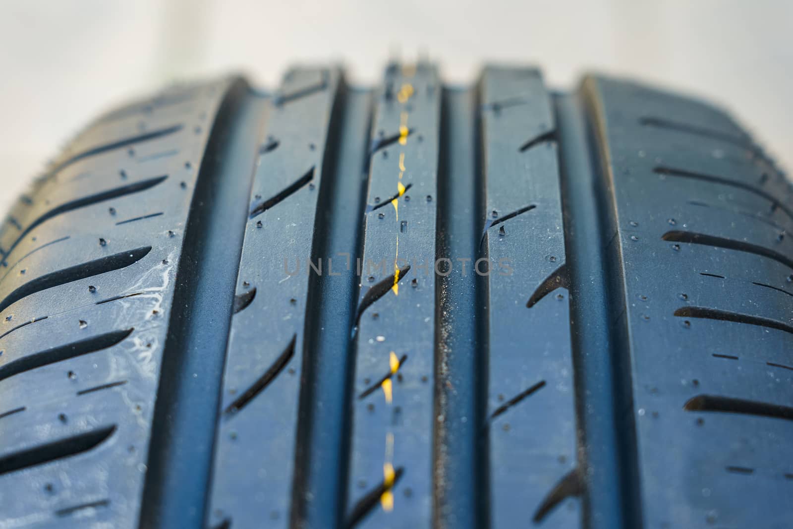 car tire, tread design with selective focus, close-up