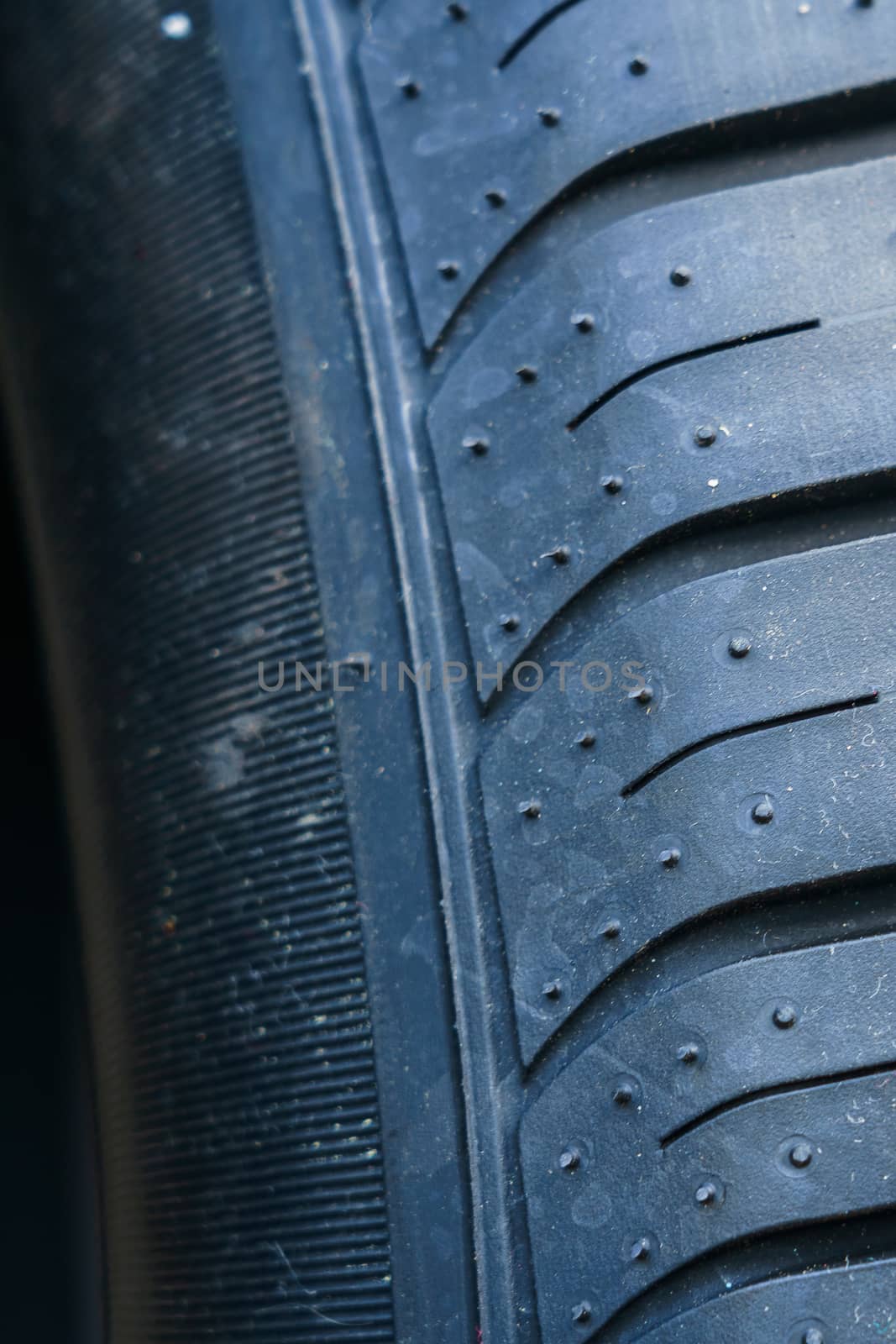 car tire, tread design with selective focus, close-up