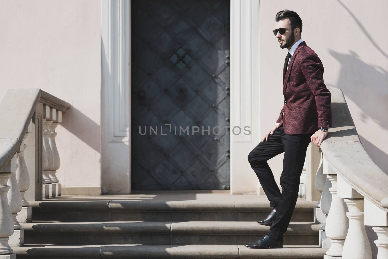 Fashionable businessman outdoors by wdnet_studio