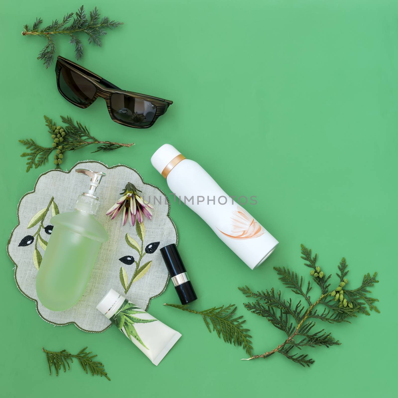 Cosmetics items on a light green background. by georgina198