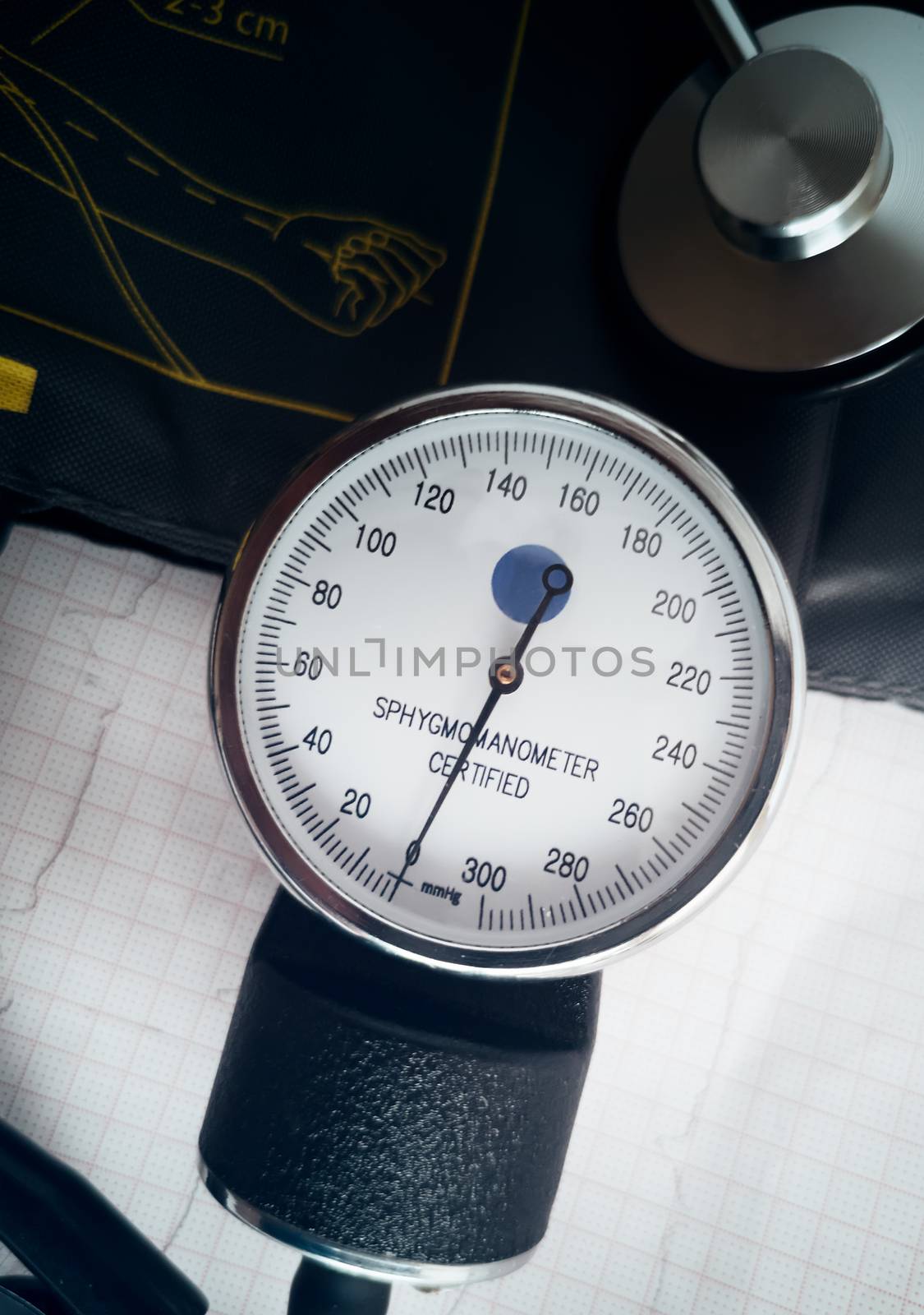 Against the background of medical documentation medical instruments: stethoscope for auscultation of patients and apparatus for measuring blood pressure.