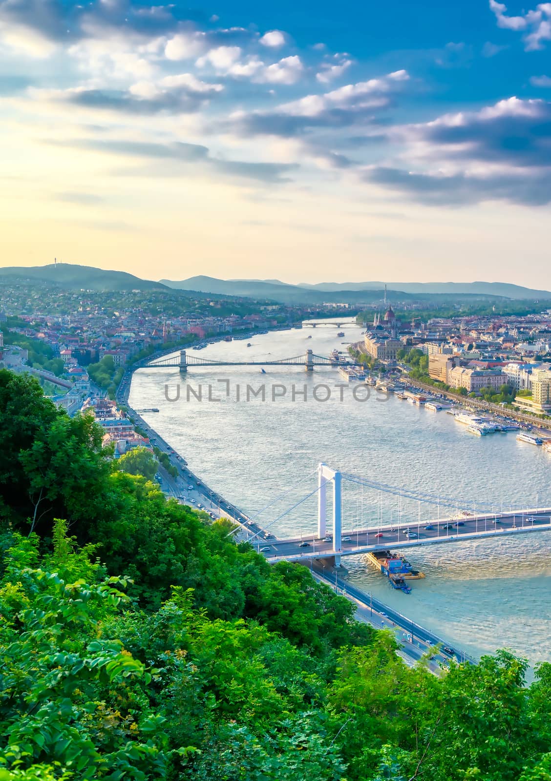 A view along the Danube River of Budapest, Hungary from Gellert Hill at sunset.