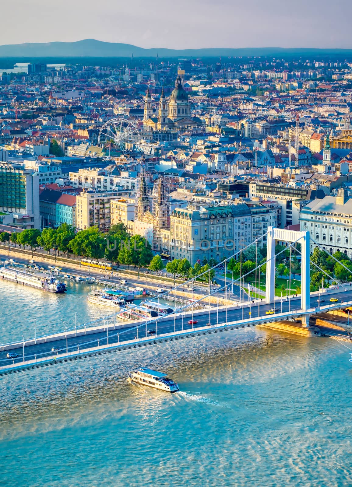 A view along the Danube River of Budapest, Hungary from Gellert Hill at sunset.