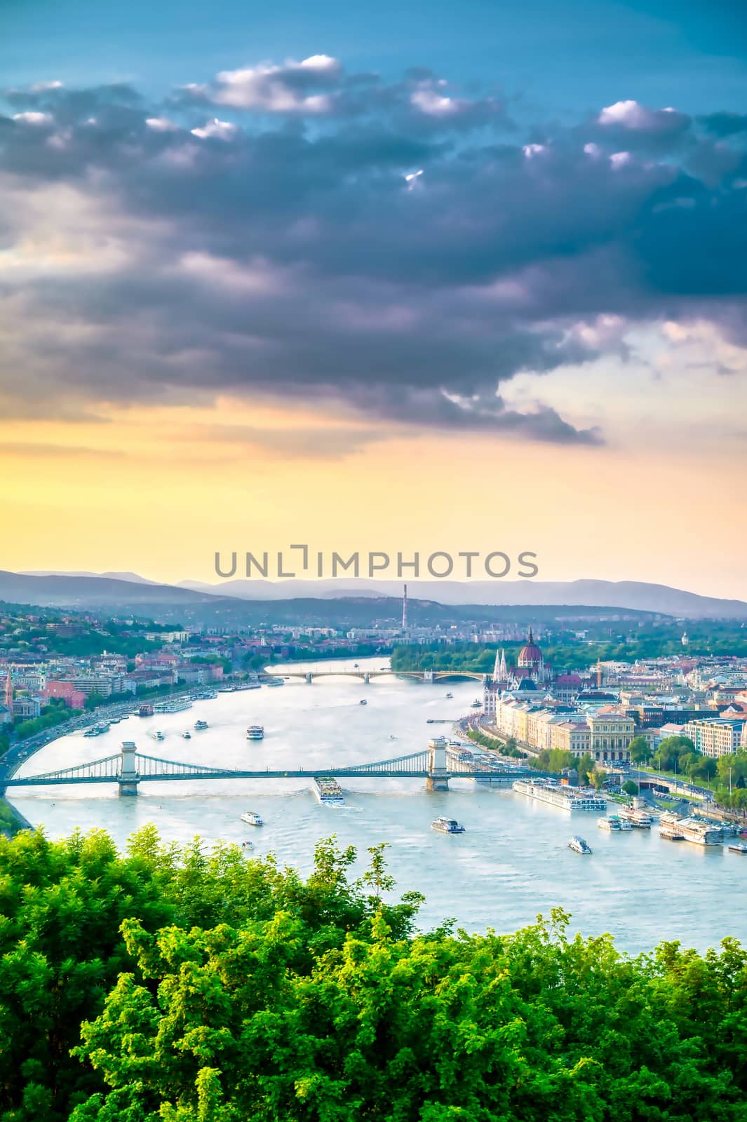 A view along the Danube River of Budapest, Hungary from Gellert Hill at sunset.