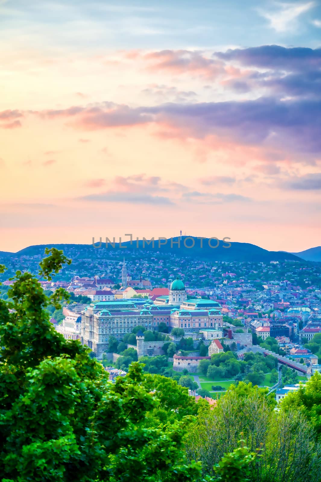 A view along the Danube River of Budapest, Hungary from Gellert Hill at sunset.