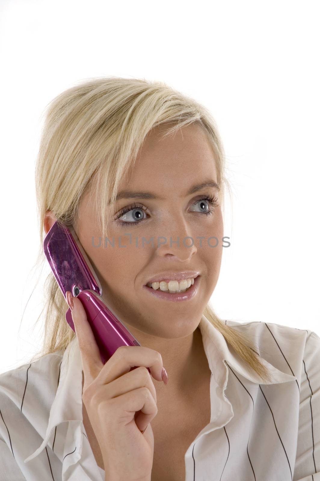 A pretty blonde woman using a mobile telephone