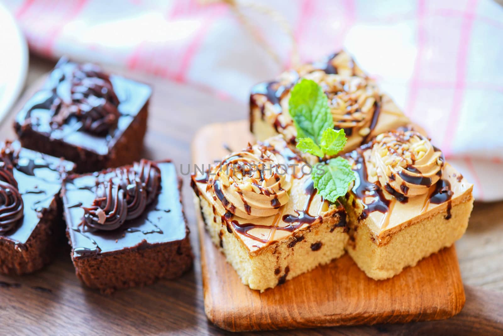 Coffee cake topping chocolate delicious sweet dessert served on the table / cake chocolate slice on wooden with mint leaf for breakfast
